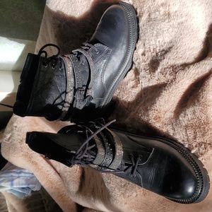 Cool pair of pure black leather lace up booties with three blingy straps